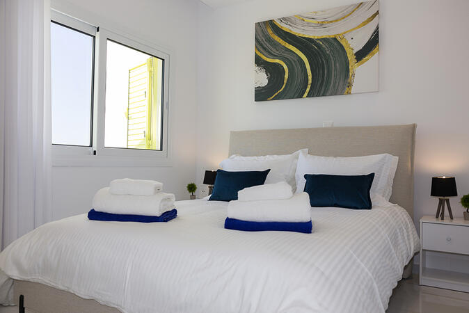 Second-floor bedroom with comfortable sleeping accommodation.