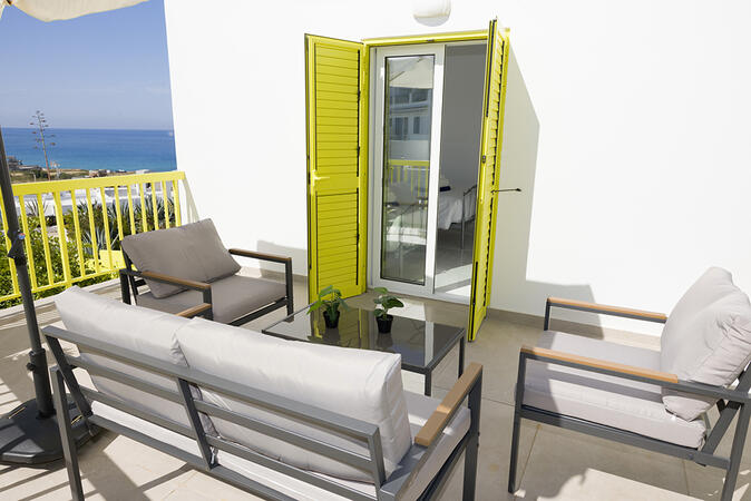 Sunny balcony overlooking the surroundings of Ikaria Village.