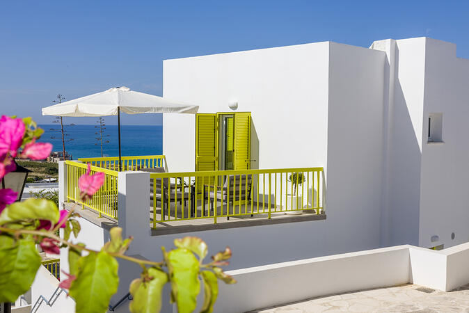 Private outdoor balcony seating area at Yellow16.