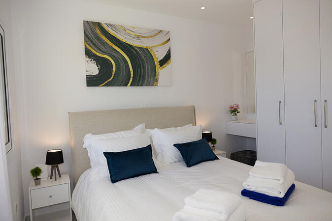 Bright guest bedroom on the upper floor of Yellow16.