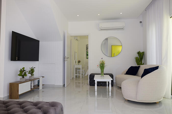 Bright open-plan lounge area in Yellow16 Holiday Apartment.